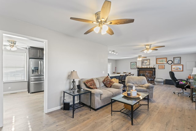 living room with light hardwood / wood-style floors