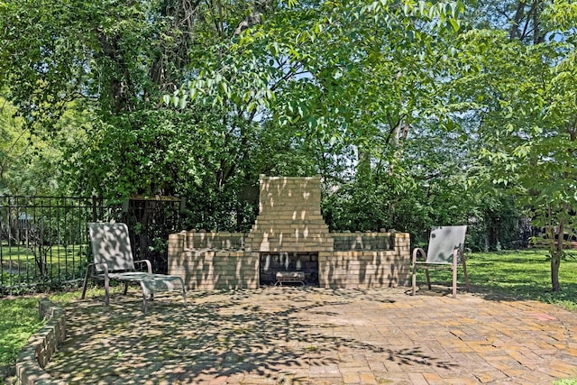 1704 Temple Ave, Nashville, TN 37215 - view of patio featuring an outdoor brick fireplace