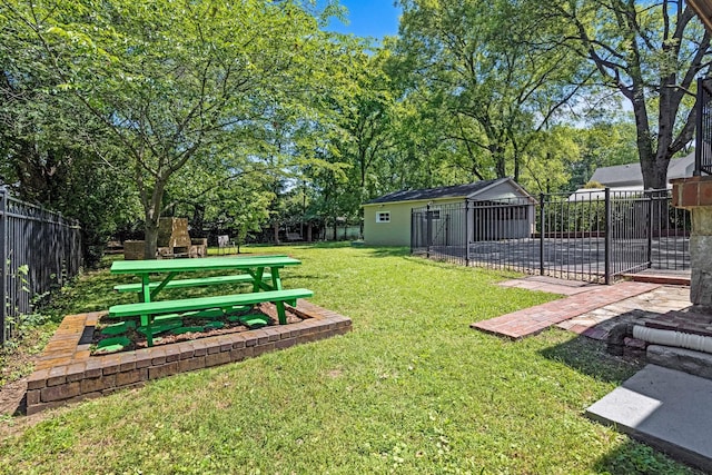 1704 Temple Ave, Nashville, TN 37215 - view of yard with an outdoor structure, an outdoor stone fireplace, and a patio area