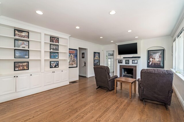 1704 Temple Ave, Nashville, TN 37215 - living room with hardwood / wood-style flooring, ornamental molding, and a fireplace
