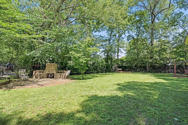1704 Temple Ave, Nashville, TN 37215 - view of yard with a patio and an outdoor stone fireplace