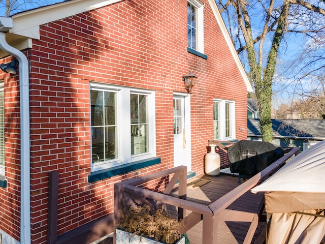 wooden terrace with grilling area