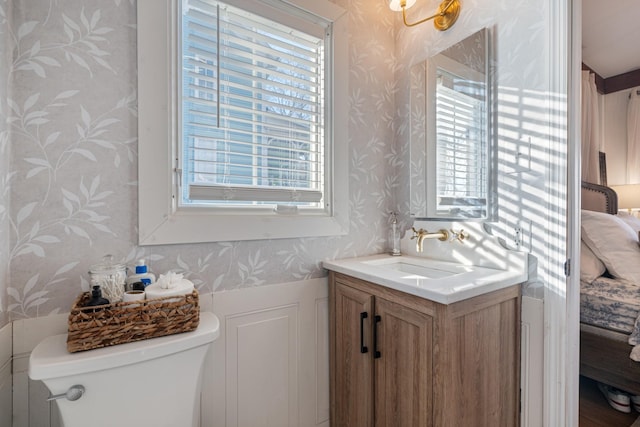 bathroom featuring vanity and toilet