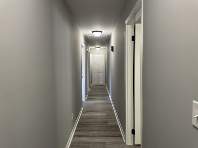 corridor featuring dark hardwood / wood-style flooring