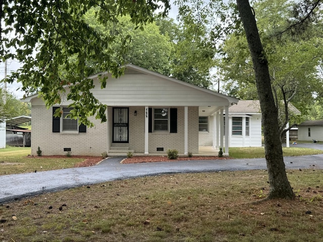 bungalow with a front yard