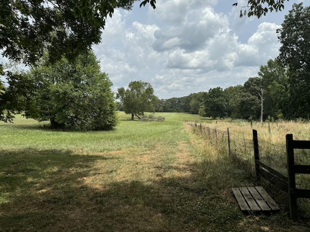 view of yard with a rural view