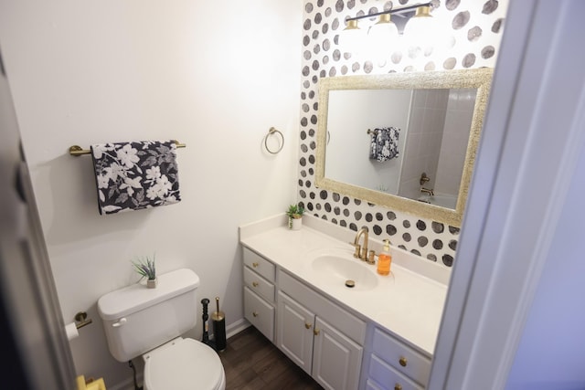 bathroom featuring hardwood / wood-style flooring, vanity, and toilet