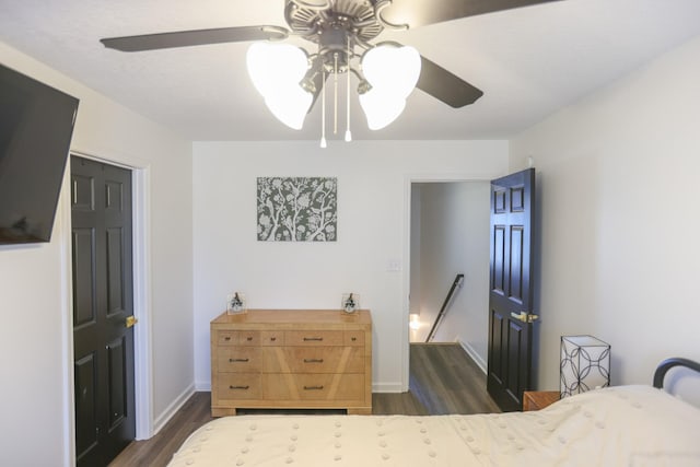 bedroom featuring dark hardwood / wood-style flooring and ceiling fan