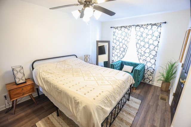 bedroom featuring dark wood-type flooring and ceiling fan