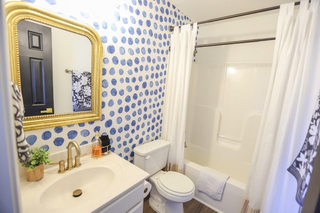 full bathroom featuring toilet, vanity, and shower / bath combo with shower curtain