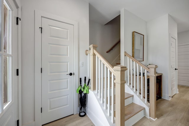 stairs featuring hardwood / wood-style flooring