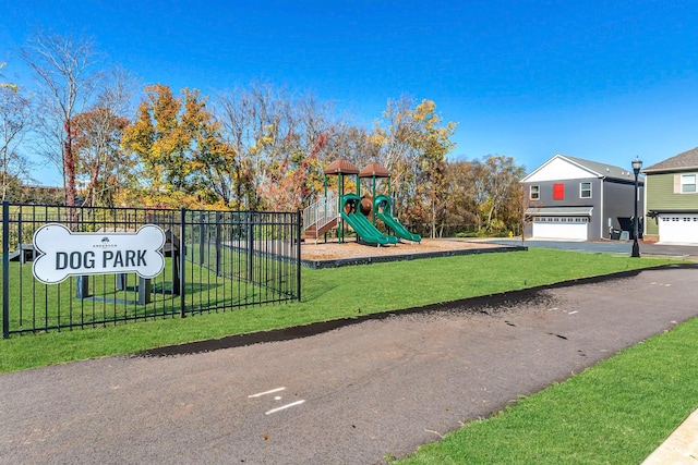 view of jungle gym featuring a lawn