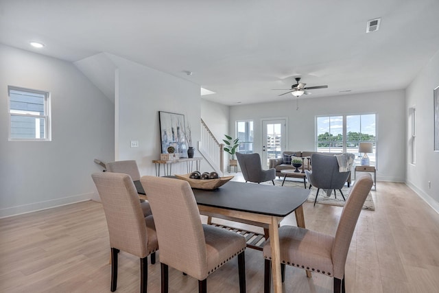 dining space featuring light hardwood / wood-style flooring and ceiling fan