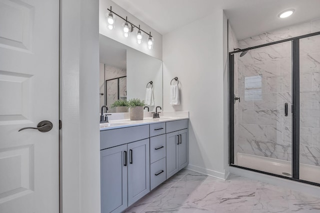 bathroom featuring vanity and a shower with shower door