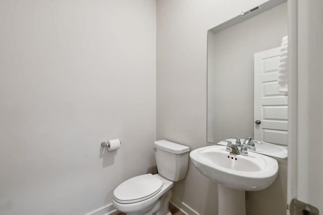 bathroom with sink and toilet