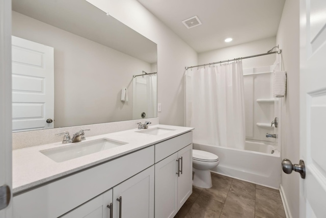 full bathroom featuring vanity, shower / tub combo, tile patterned floors, and toilet