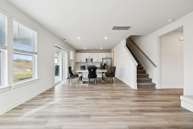 dining room featuring light hardwood / wood-style floors