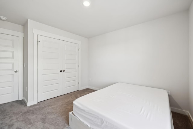 carpeted bedroom featuring a closet