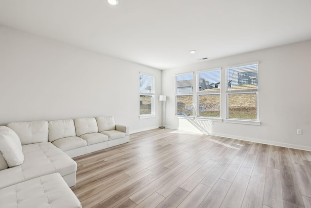 unfurnished living room with light hardwood / wood-style flooring