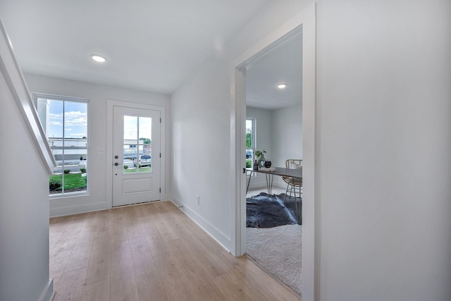 doorway with light hardwood / wood-style floors