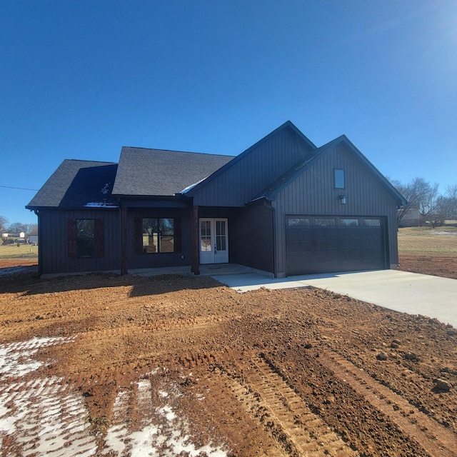 modern farmhouse featuring a garage