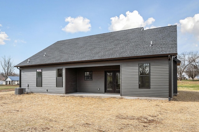 rear view of property with central AC and a patio area