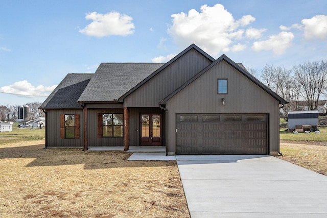 modern inspired farmhouse with covered porch and a garage