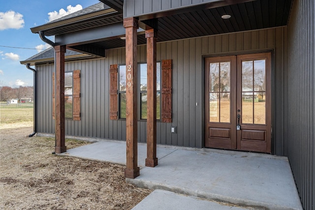 property entrance with a patio and french doors