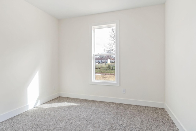 carpeted spare room featuring a wealth of natural light