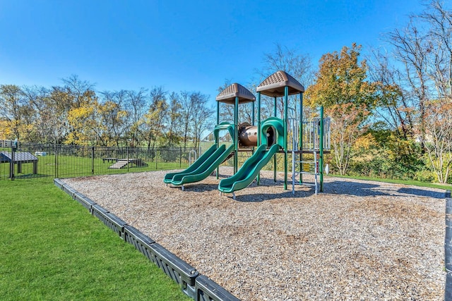 view of playground with a lawn