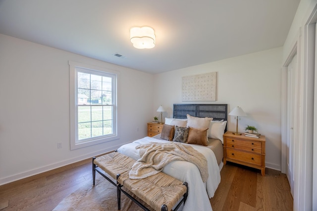 bedroom with hardwood / wood-style floors