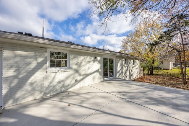 back of house with a patio area