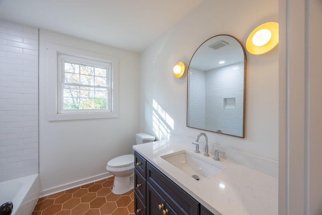 bathroom with vanity, tile patterned floors, and toilet