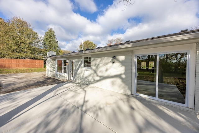 back of property with a patio