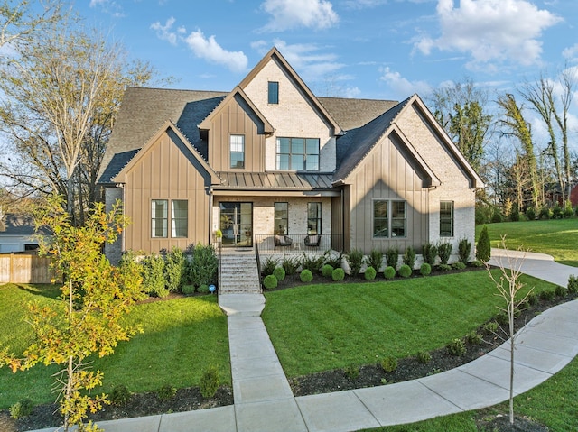 view of front of house featuring a front lawn and a porch