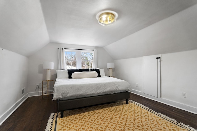 bedroom featuring wood-type flooring and vaulted ceiling