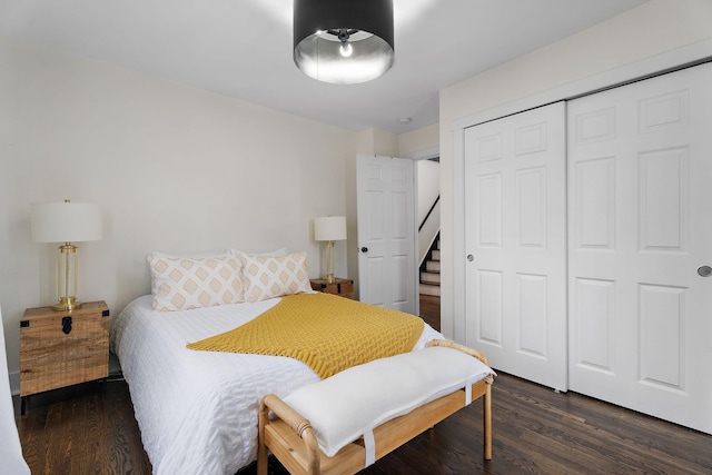 bedroom featuring dark wood-type flooring and a closet