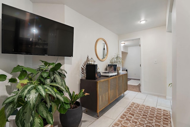 hall featuring light tile patterned floors