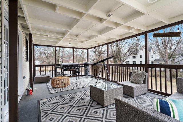 sunroom / solarium featuring coffered ceiling