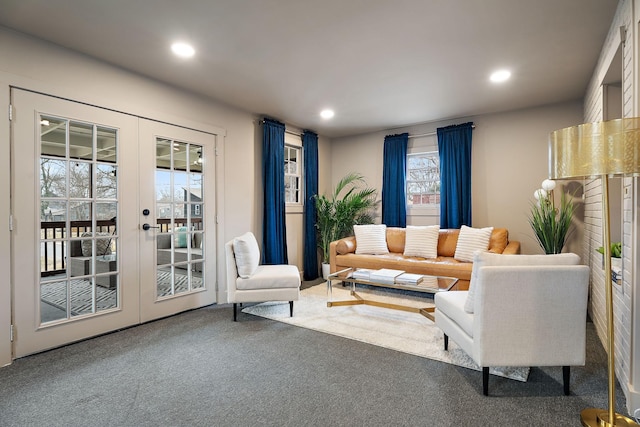 carpeted living room with french doors