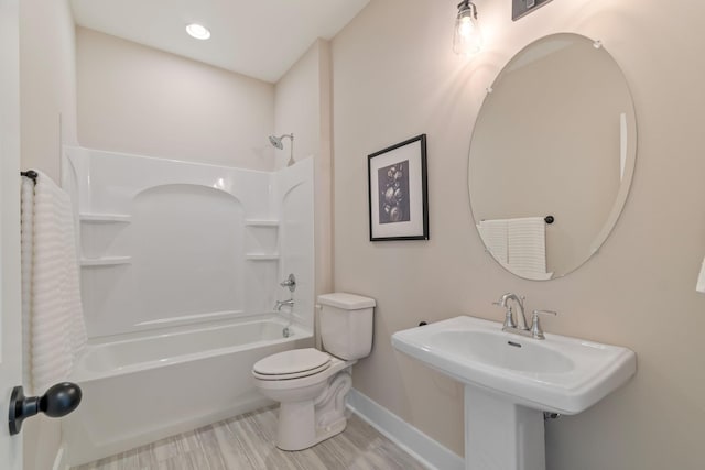 full bathroom with tub / shower combination, sink, and toilet