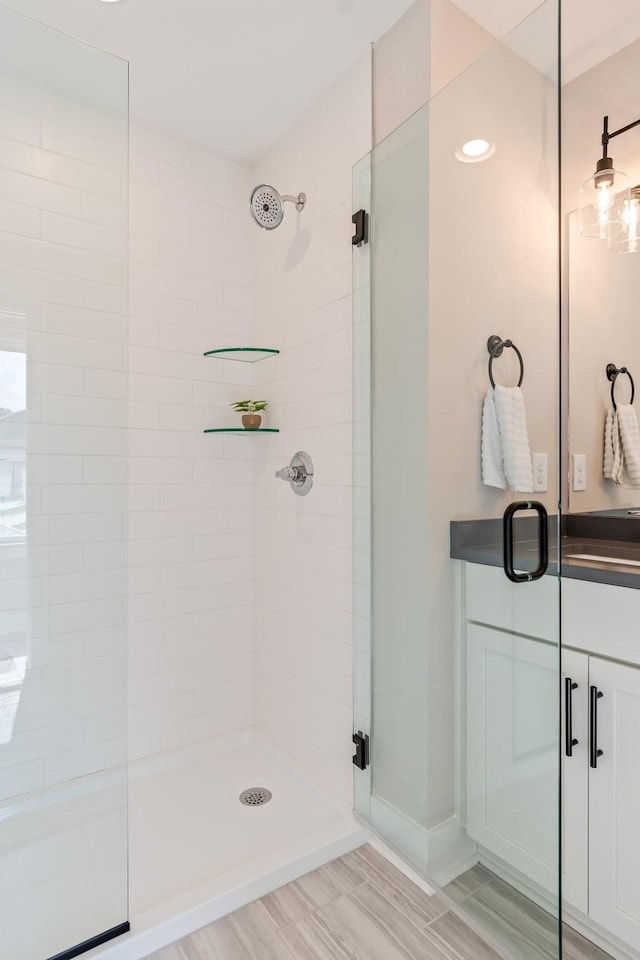 bathroom featuring an enclosed shower