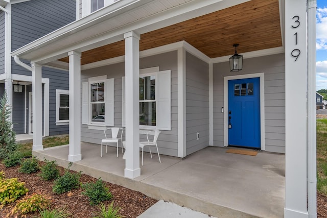 doorway to property with covered porch