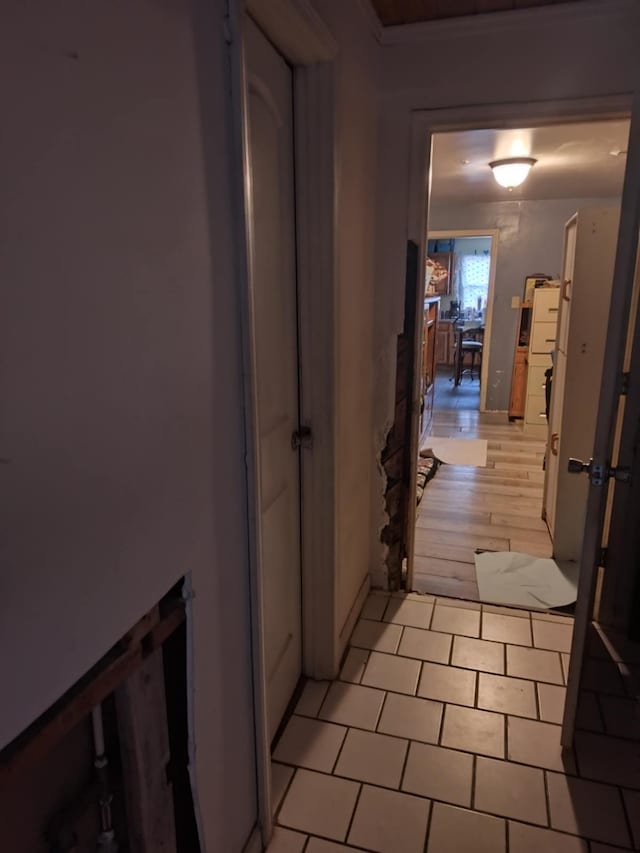 hall with light tile patterned flooring