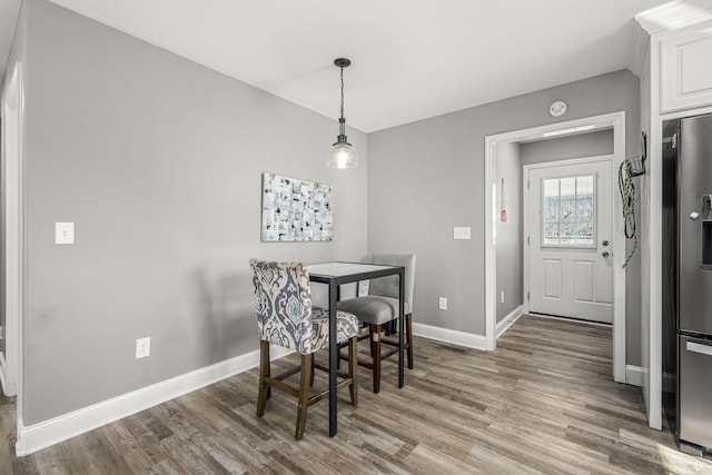 dining area with hardwood / wood-style flooring