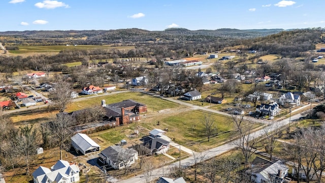 birds eye view of property with a mountain view