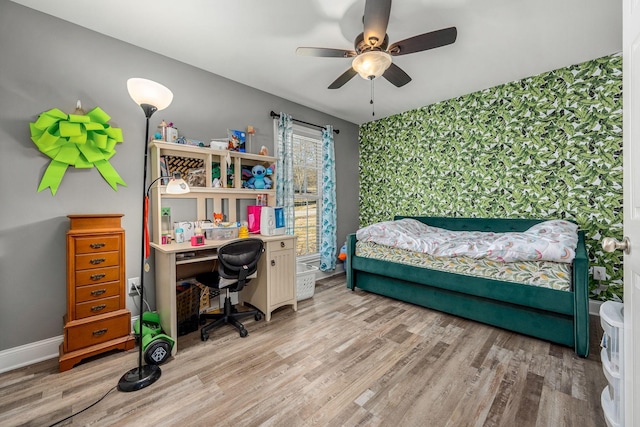 bedroom featuring ceiling fan and light wood-type flooring