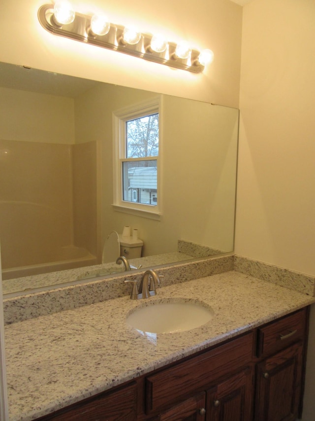 bathroom with vanity and toilet