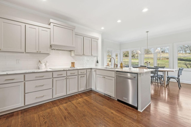 kitchen with tasteful backsplash, ornamental molding, decorative light fixtures, stainless steel dishwasher, and kitchen peninsula