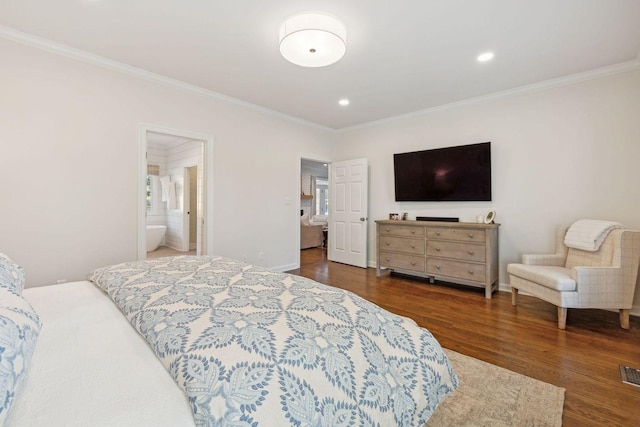 bedroom featuring crown molding, ensuite bath, and dark hardwood / wood-style floors